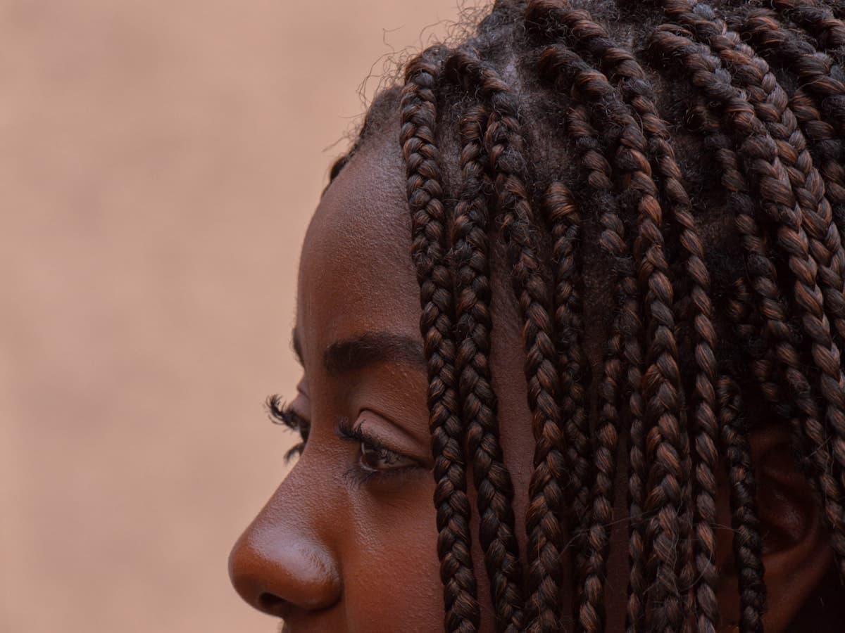 A Gabriela cosmetology graduate wearing a long braided style